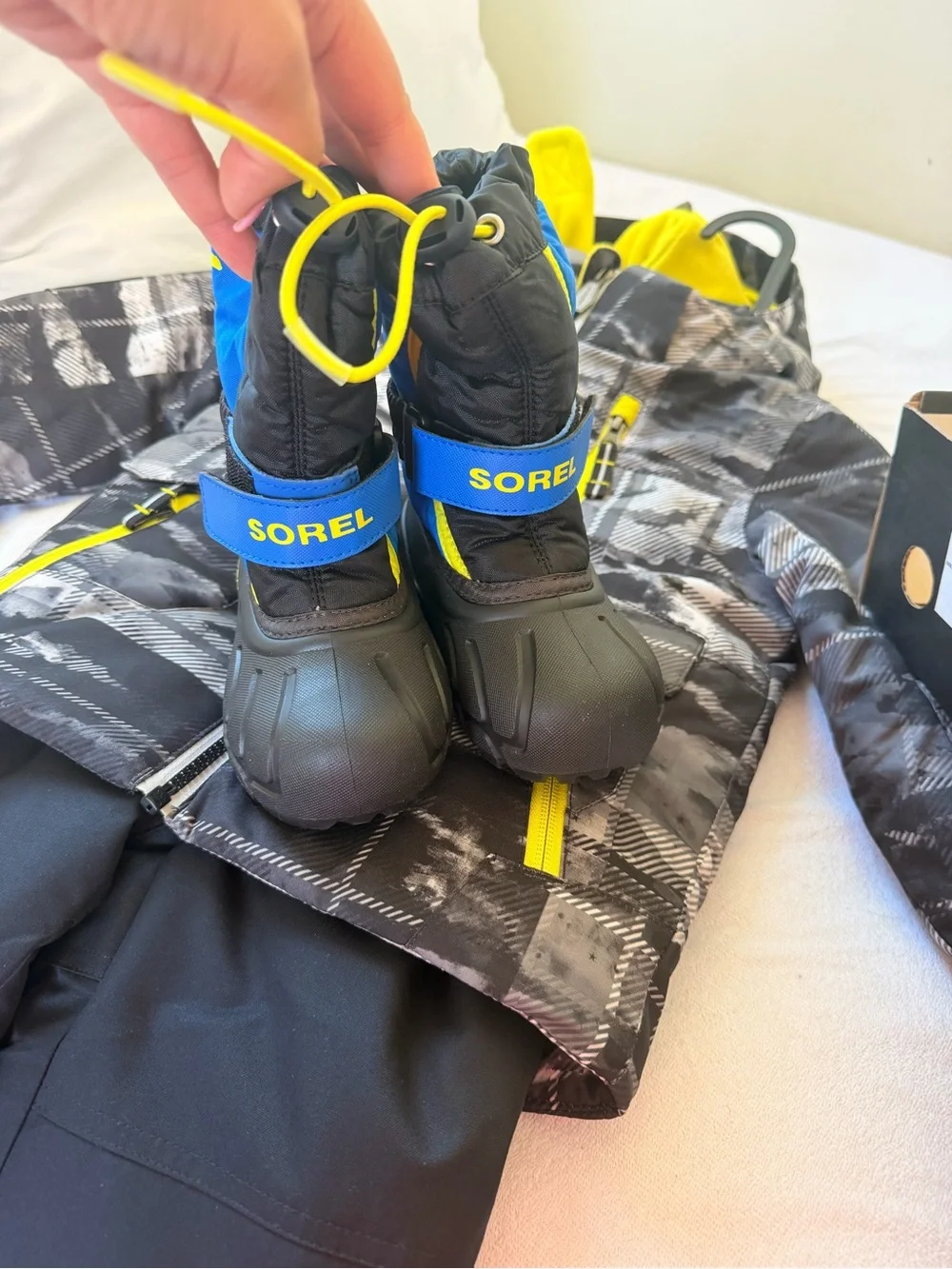 Sorel Kids Black, Blue & Yellow Snow Boots & snow gear.